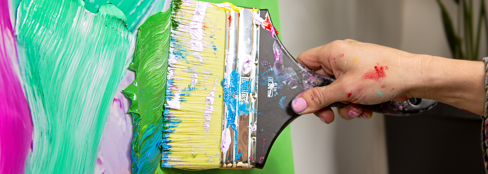 Artist painting in studio